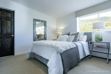 Example of a mid-sized trendy master carpeted bedroom design in Denver with white walls and no fireplace