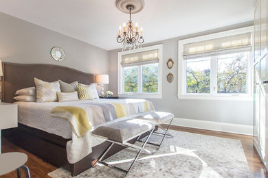 Bedroom - master medium tone wood floor bedroom idea in Toronto with gray walls and no fireplace