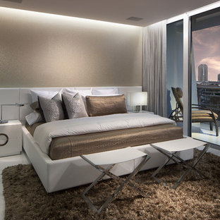 Small trendy master porcelain tile bedroom photo in Miami with beige walls