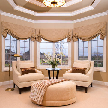 Master Bedroom Sitting Area with Tray Ceiling and Oversized Ottoman