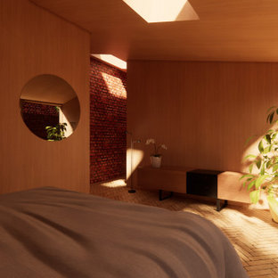 Ejemplo de dormitorio principal, moderno, pequeño, sin chimenea, con parades naranjas, suelo de ladrillo y suelo beige