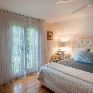 Master Bedroom with a Romantic Custom Sheer Fabric Drapes.