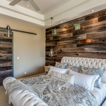 Master Bedroom with Custom Barnwood Wall and Media Center with Fireplace