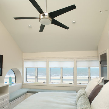 Master bedroom with custom window seating with beautiful views of the beach