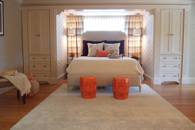 Example of a mid-sized transitional master medium tone wood floor bedroom design in Boston with multicolored walls