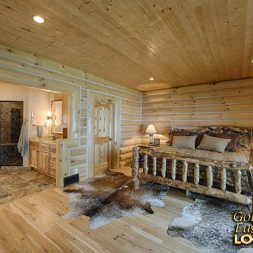 Master bedroom with open bathroom rustic wood walls