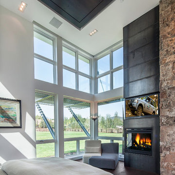 master bedroom with steel & stone fireplace