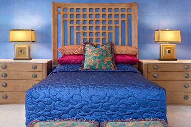 Example of an asian carpeted bedroom design in Phoenix with blue walls