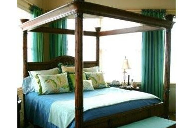 Mid-sized elegant guest medium tone wood floor and brown floor bedroom photo in Other with white walls and no fireplace