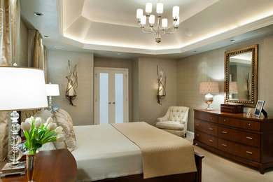 Example of a large transitional master carpeted bedroom design in Other with gray walls