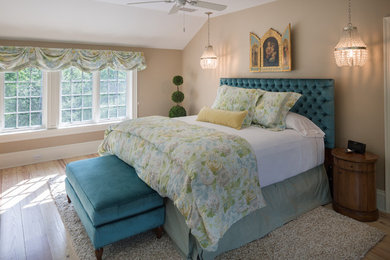 Photo of a large traditional master bedroom in Indianapolis with beige walls, light hardwood flooring and no fireplace.