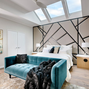 Inspiration for an expansive contemporary master bedroom in Perth with grey walls, medium hardwood floors, no fireplace and brown floor.