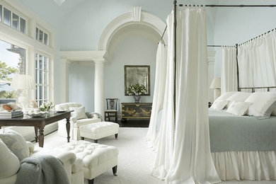 Large elegant master dark wood floor and white floor bedroom photo in Charlotte with blue walls