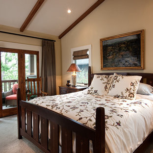 Mid-sized arts and crafts master bedroom in San Diego with beige walls, carpet, no fireplace and beige floor.