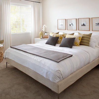 Trendy carpeted bedroom photo in Calgary with beige walls