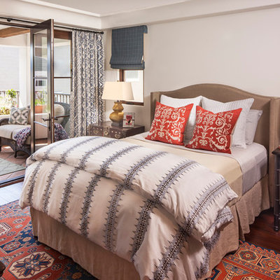 Example of a mid-sized tuscan bedroom design in Los Angeles with white walls