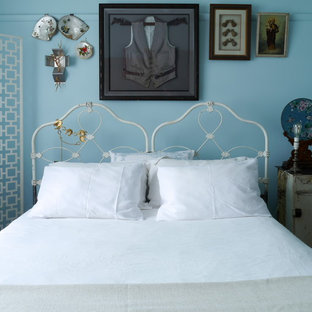 Shabby-chic style bedroom in Melbourne with blue walls.