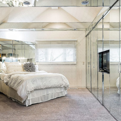 Example of a mid-sized trendy master carpeted and gray floor bedroom design in Columbus with white walls and no fireplace