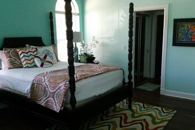 Bedroom - mid-sized coastal guest dark wood floor bedroom idea in Orlando with blue walls and no fireplace