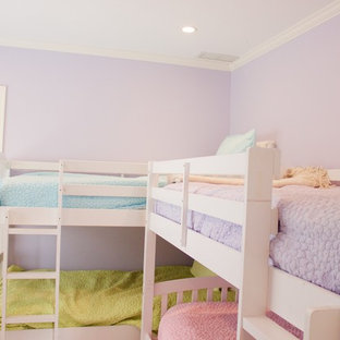 Design ideas for a mid-sized arts and crafts guest bedroom in Chicago with purple walls, dark hardwood floors and no fireplace.