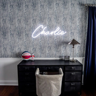 Mid-sized industrial bedroom in Other with blue walls and brown floor.