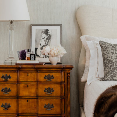 Inspiration for a huge transitional master dark wood floor and brown floor bedroom remodel in Boston with beige walls, a standard fireplace and a stone fireplace
