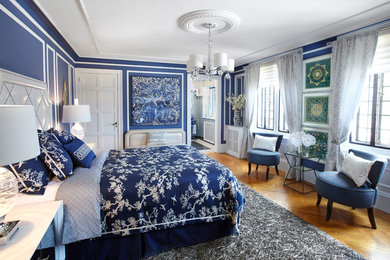 Design ideas for a medium sized traditional master bedroom in New York with blue walls, light hardwood flooring and no fireplace.