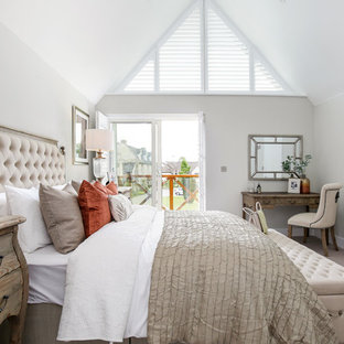 This is an example of a shabby-chic style bedroom in Other with beige walls, carpet and beige floors.