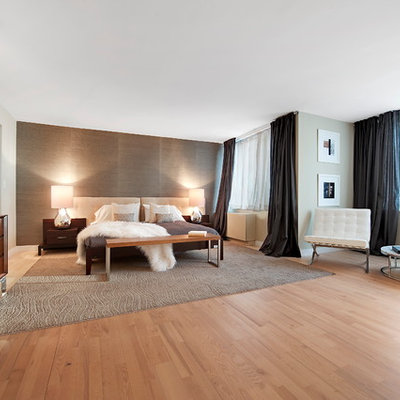 Inspiration for a contemporary light wood floor bedroom remodel in New York with gray walls