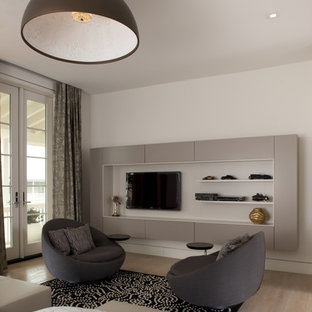 Example of a danish light wood floor bedroom design in Other with white walls