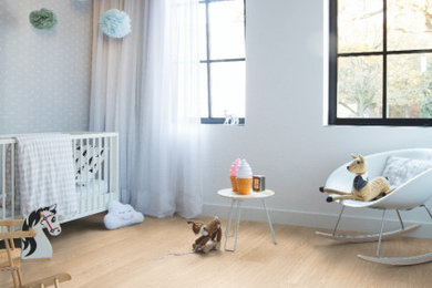 Modern bedroom in Other with vinyl flooring and beige floors.