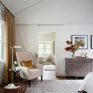Country bedroom in Austin with white walls.