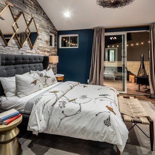 Inspiration for a transitional medium tone wood floor bedroom remodel in Los Angeles with blue walls and no fireplace