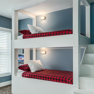 Large cottage carpeted and brown floor bedroom photo in Calgary with blue walls