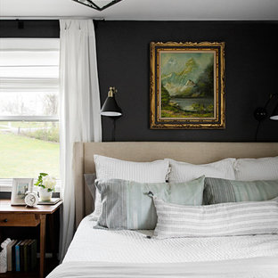 Inspiration for a transitional medium tone wood floor and brown floor bedroom remodel in Nashville with gray walls