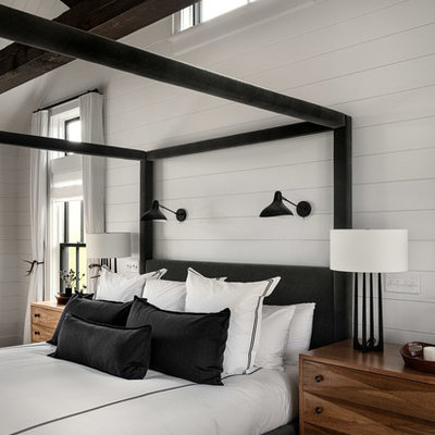 Large farmhouse master dark wood floor and brown floor bedroom photo in New York with white walls