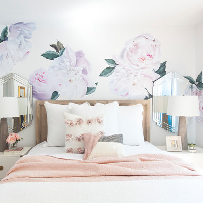 Inspiration for a small contemporary master brown floor and medium tone wood floor bedroom remodel in San Francisco with white walls and no fireplace
