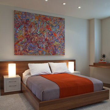 Modern Neutral Bedroom with Wood and Orange accents