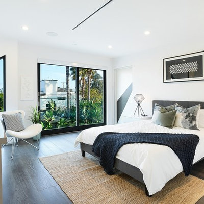 Trendy dark wood floor bedroom photo in Los Angeles with white walls and no fireplace