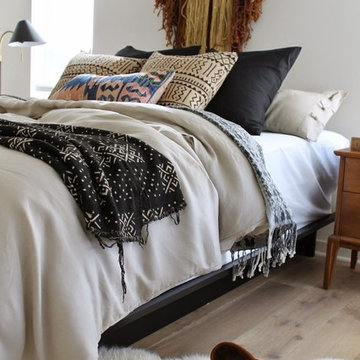 Modern Tonal Bedroom with African Mudcloth and Sheepskin Rug