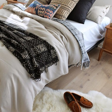 Modern Tonal Bedroom with African Mudcloth and Sheepskin Rug