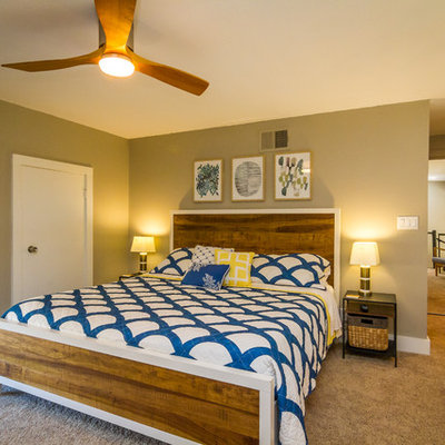 Island style master carpeted and brown floor bedroom photo in Hawaii with brown walls