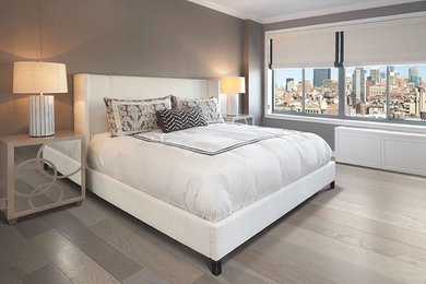 Example of a mid-sized trendy master light wood floor bedroom design in Philadelphia with gray walls