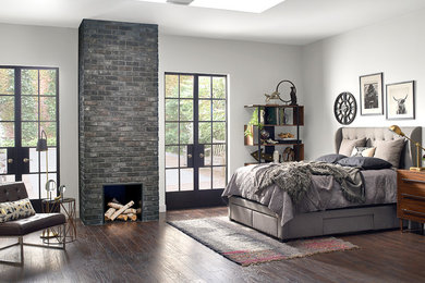 Moody and Modern Contemporary Bedroom With Dark Brick Fireplace