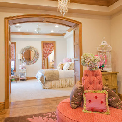Bedroom - mediterranean medium tone wood floor bedroom idea in Las Vegas with beige walls