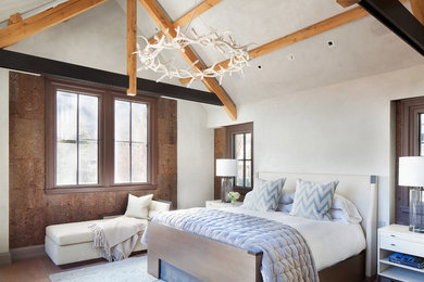 Mountain style medium tone wood floor bedroom photo in Denver with white walls