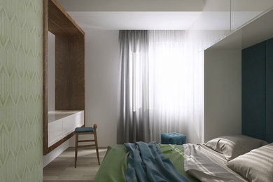 Пример оригинального дизайна: маленькая спальня в стиле модернизм с зелеными стенами и полом из ламината для на участке и в саду