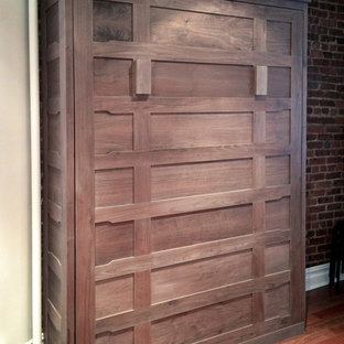 Small arts and crafts loft-style bedroom in New York with medium hardwood floors.