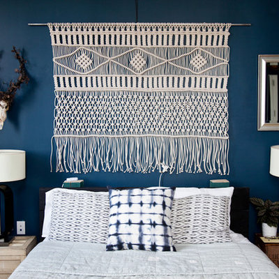 Inspiration for a mid-sized modern master light wood floor bedroom remodel in New York with blue walls