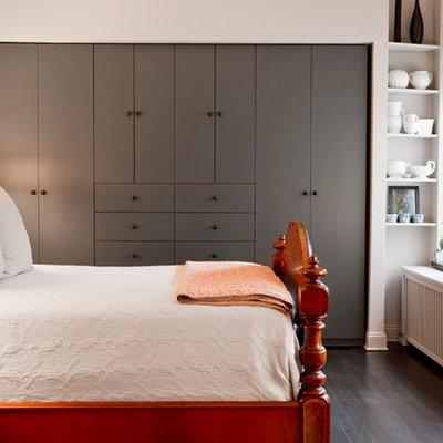 Bedroom - small transitional dark wood floor bedroom idea in New York with white walls